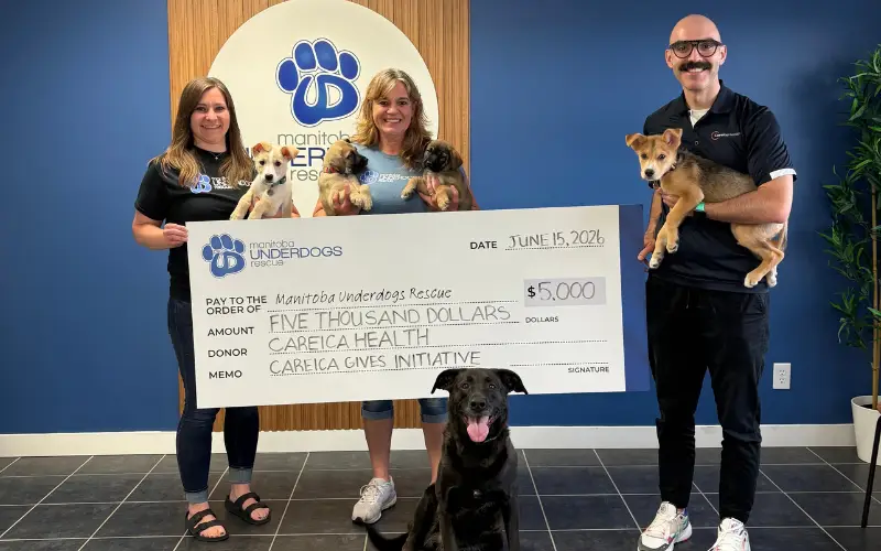 Careica presenting a donation cheque to MB Underdogs Rescue, through the Careica Gives initiative.